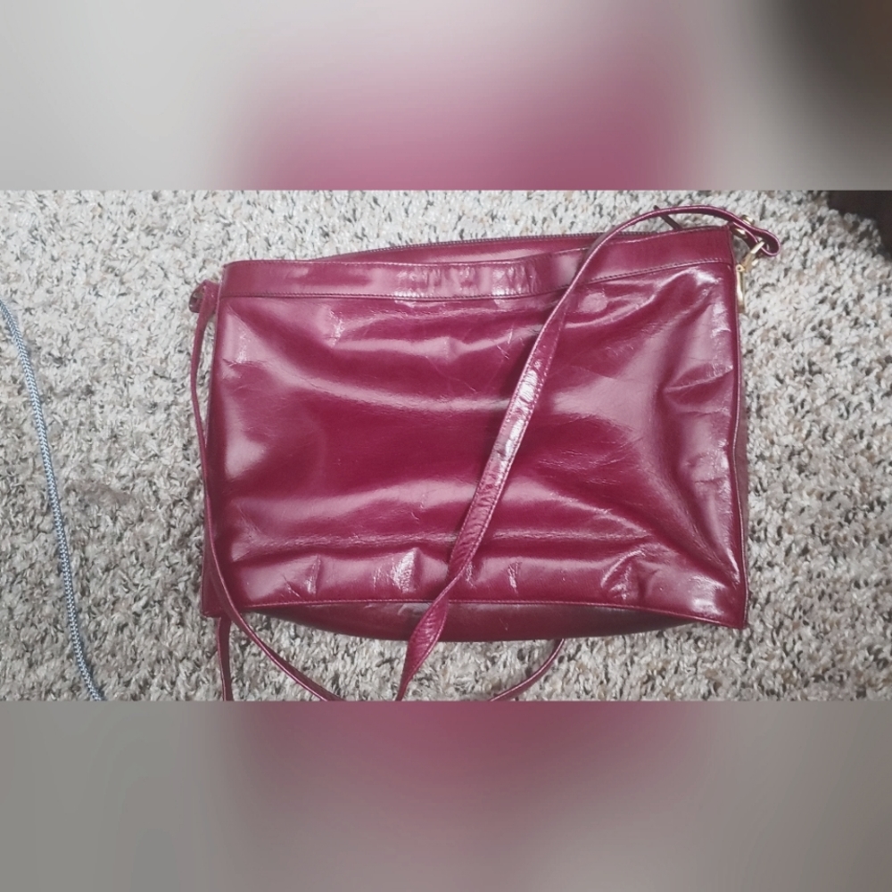 Vintage, slightly worn bag with smaller clutch inside